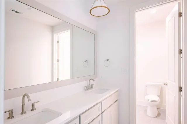 a bathroom with a sink and a toilet