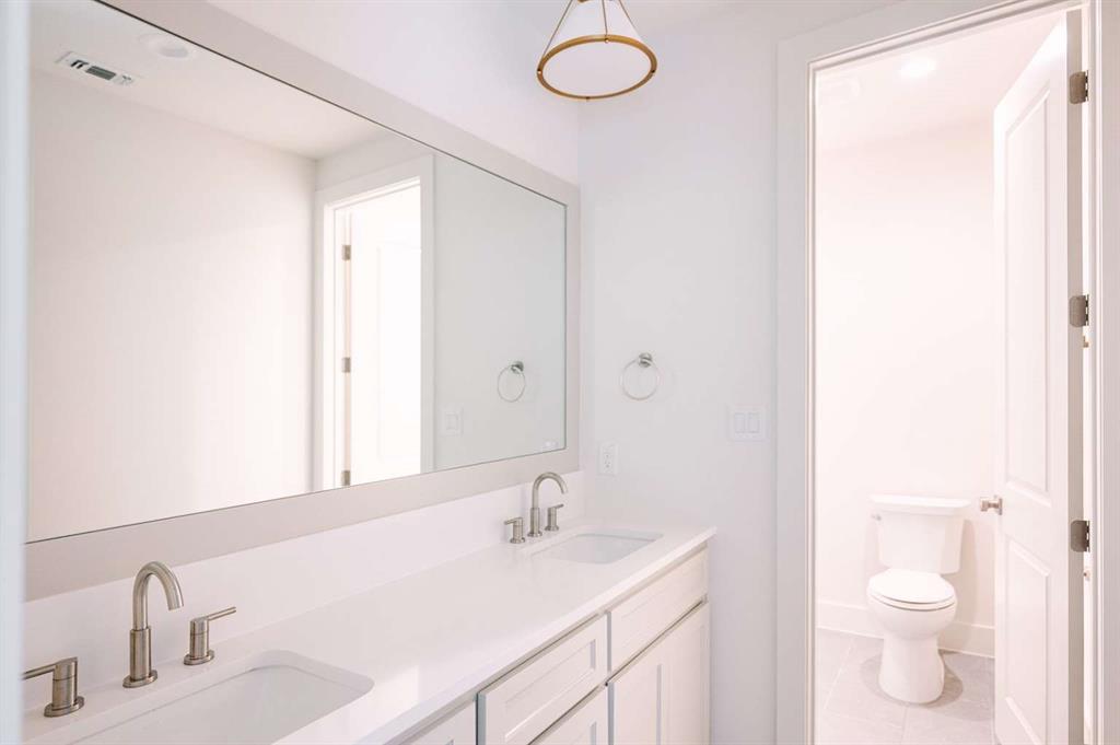 405 Kestrel Court Aledo, TX 76008 - Photo 28 of 31 a bathroom with a sink and a toilet