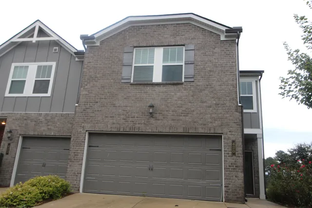 a front view of a house with garage