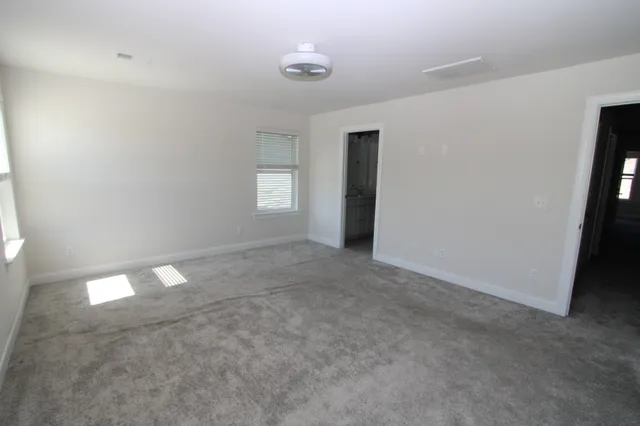 an empty room with an empty space and window