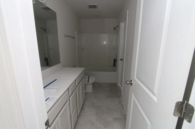 a bathroom with a sink and toilet