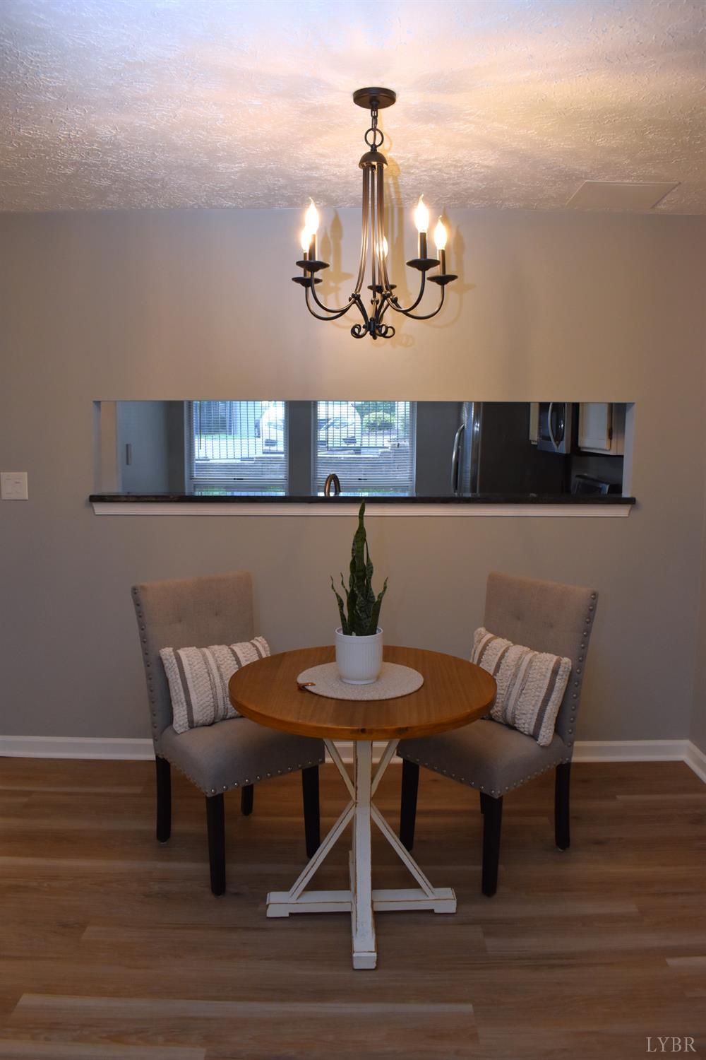 482 Oak Point Road Forest, VA 24551 - Photo 11 of 39 a view of a dining room with furniture and wooden floor