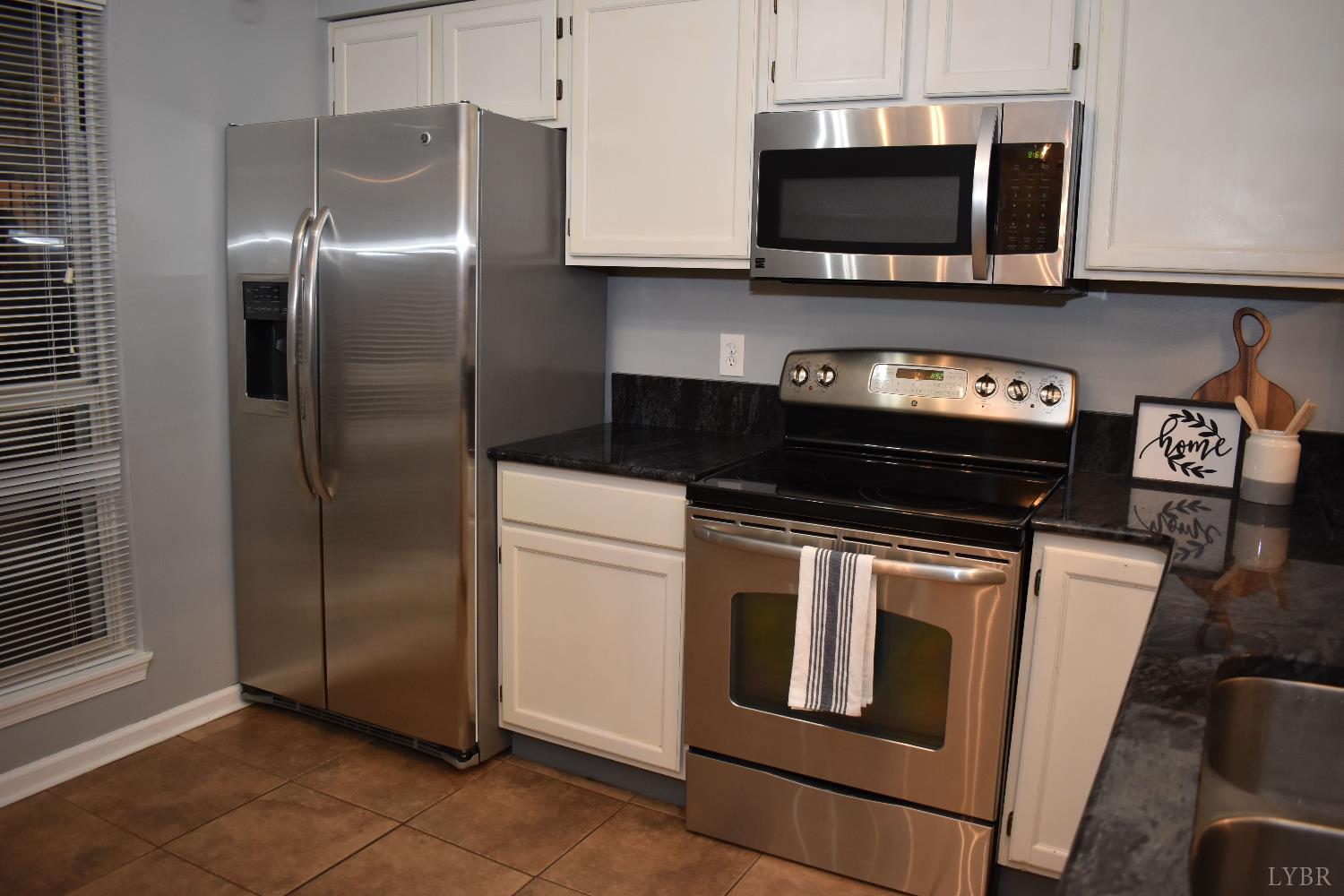 482 Oak Point Road Forest, VA 24551 - Photo 15 of 39 a kitchen with stainless steel appliances granite countertop a stove and a microwave