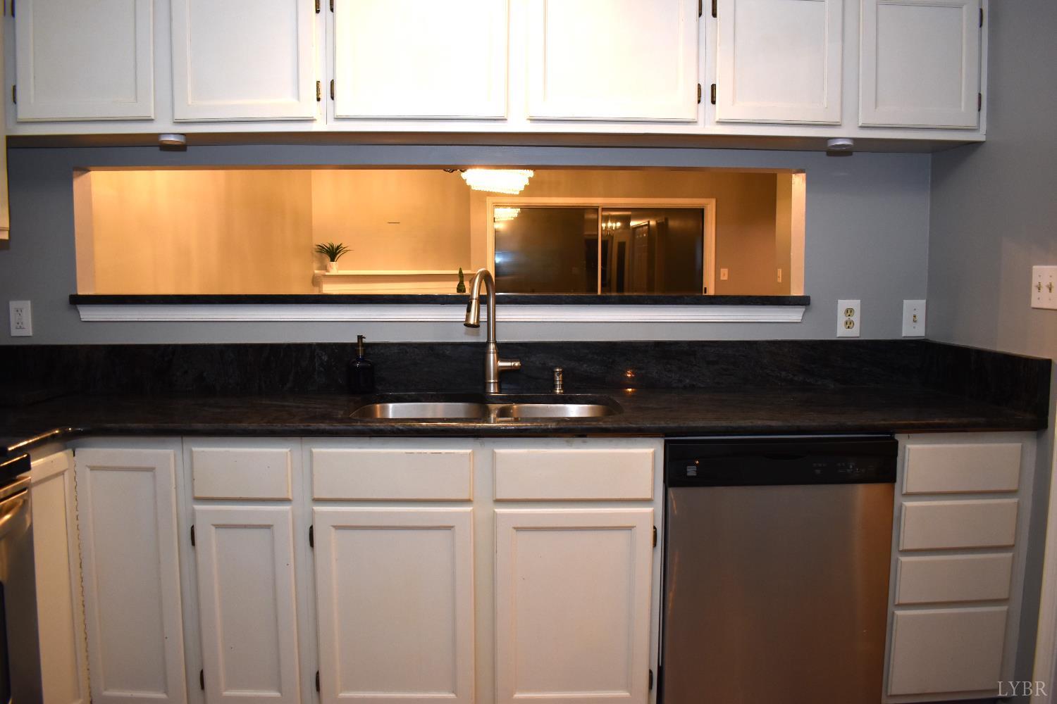 482 Oak Point Road Forest, VA 24551 - Photo 16 of 39 a kitchen with a sink and a window