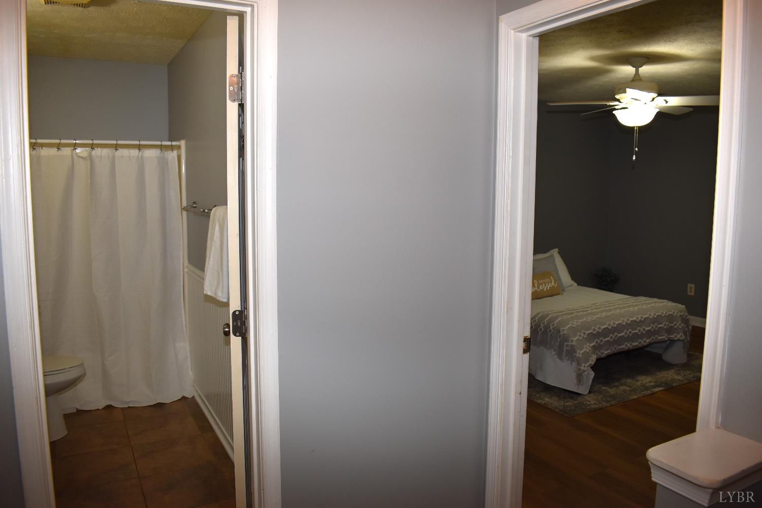 482 Oak Point Road Forest, VA 24551 - Photo 22 of 39 a view of a bedroom from a hallway