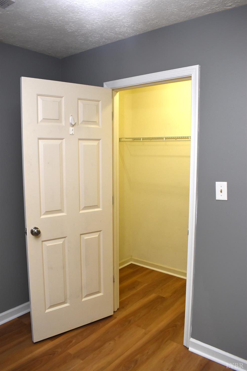 482 Oak Point Road Forest, VA 24551 - Photo 26 of 39 an empty room with wooden floor and closet