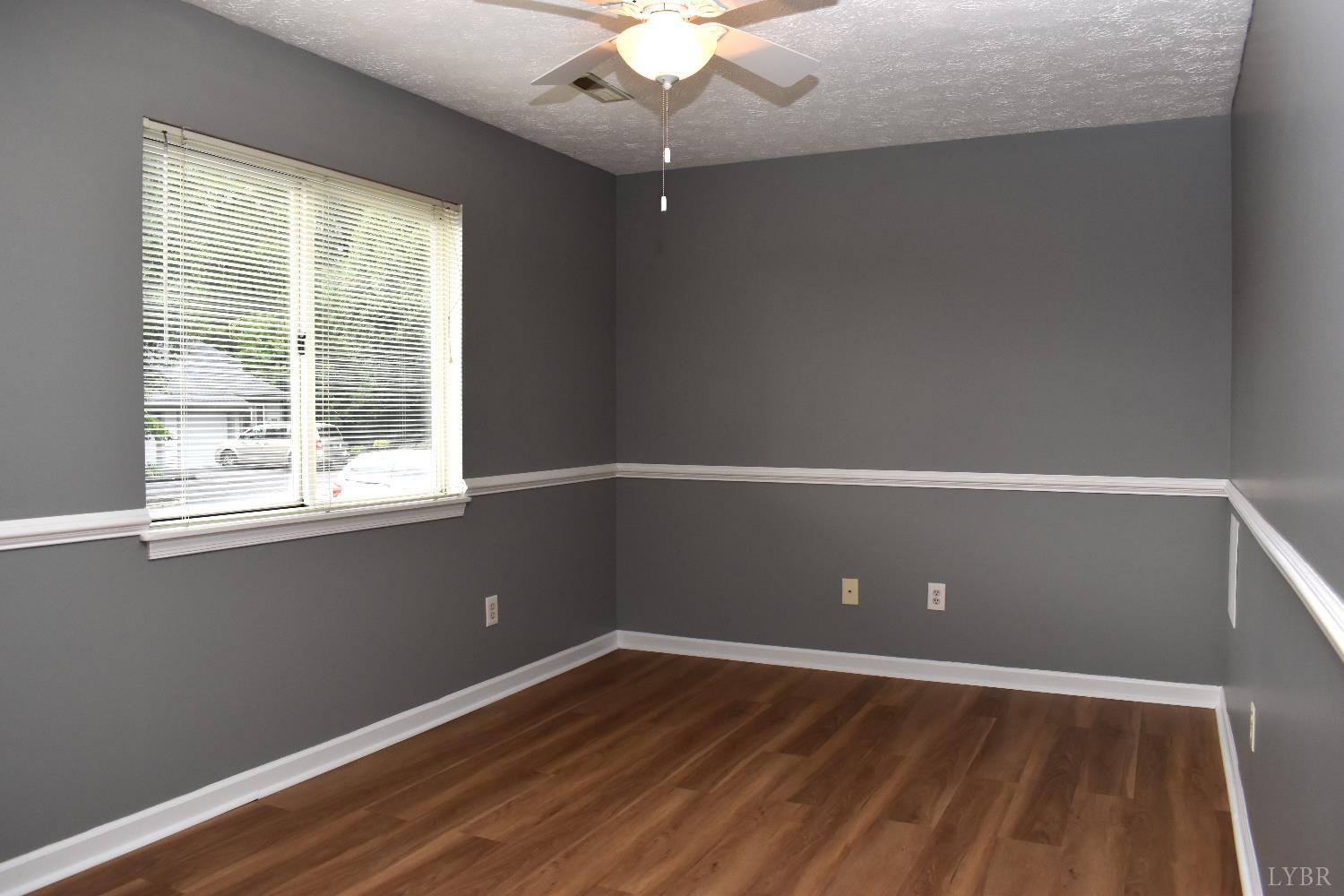 482 Oak Point Road Forest, VA 24551 - Photo 27 of 39 an empty room with wooden floor and windows
