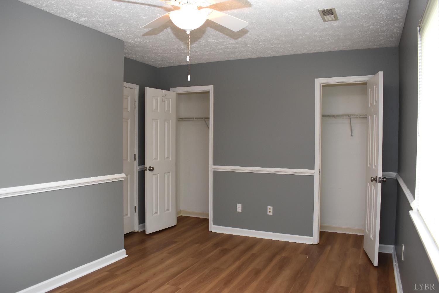 482 Oak Point Road Forest, VA 24551 - Photo 29 of 39 an empty room with wooden floor and closet