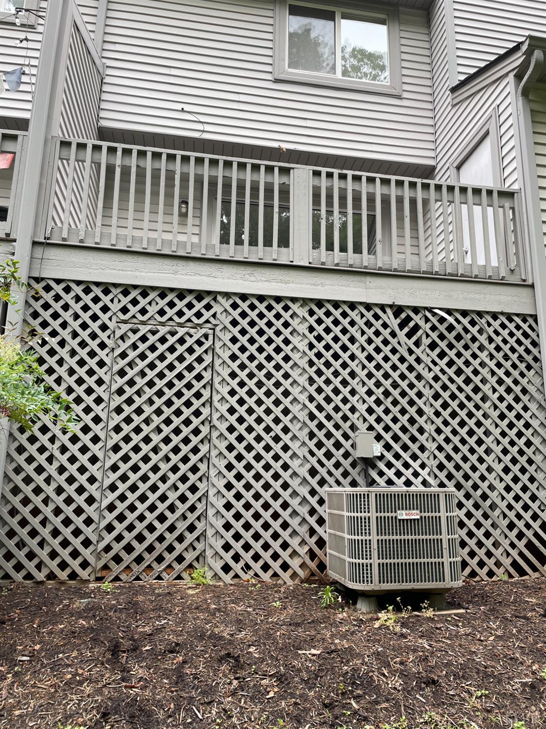 482 Oak Point Road Forest, VA 24551 - Photo 38 of 39 an outdoor view of a brick house with wooden fence