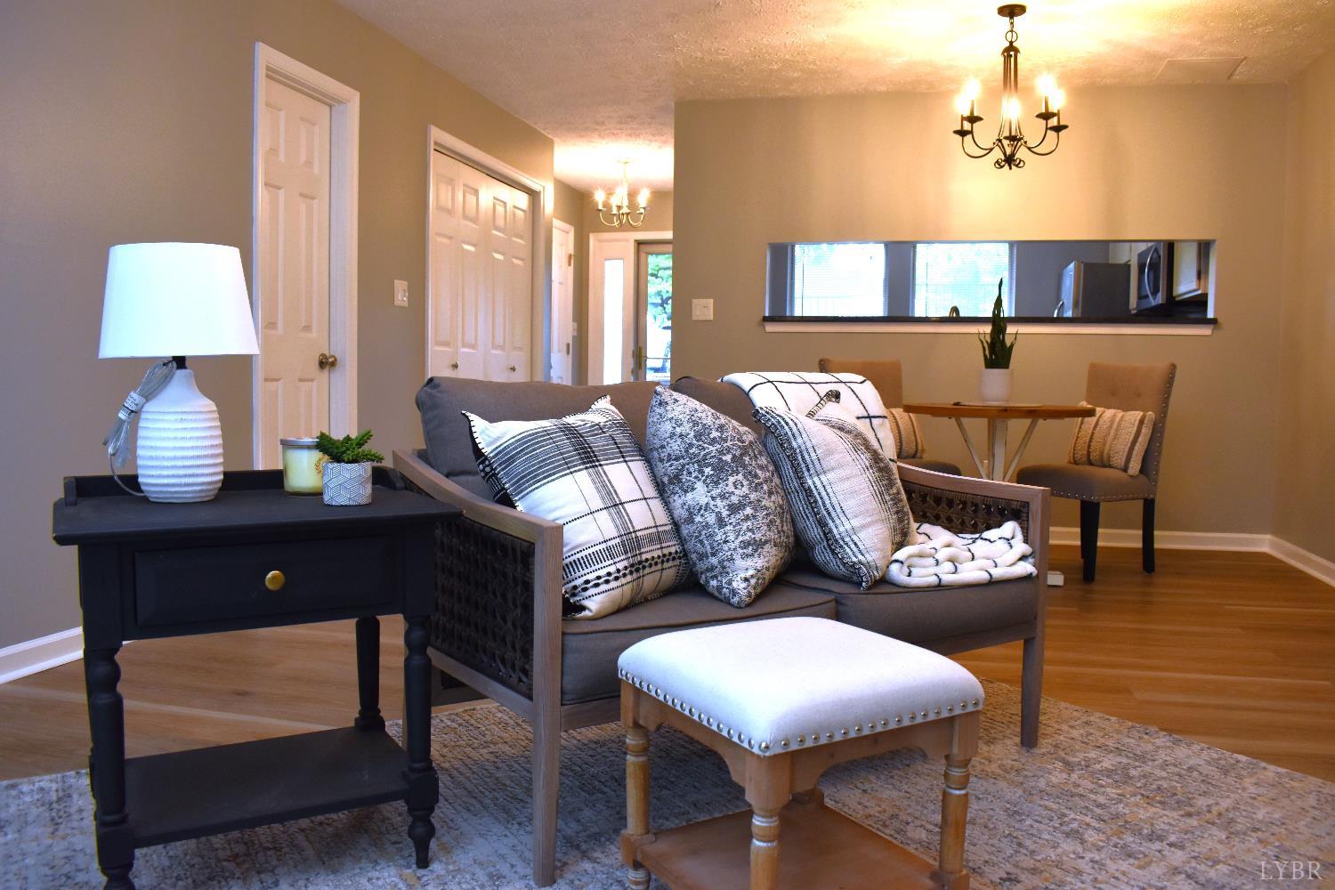482 Oak Point Road Forest, VA 24551 - Photo 5 of 39 a living room with furniture and a lamp