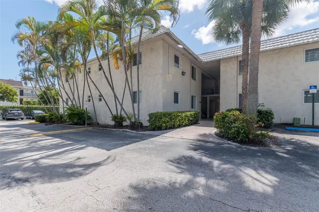 a view of a house with a small yard