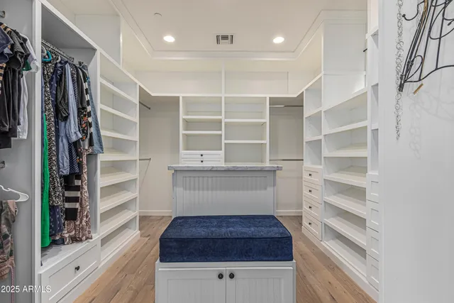 a kitchen with a stove a refrigerator a sink and cabinets