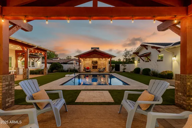 a kitchen with a stove a refrigerator a sink and cabinets