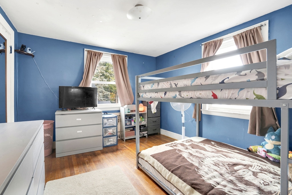 39 Range Road Boston, MA 02124 - Photo 12 of 25 a room with a bed and a television