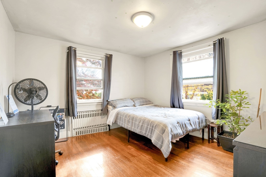 39 Range Road Boston, MA 02124 - Photo 15 of 25 a bedroom with a bed and a window