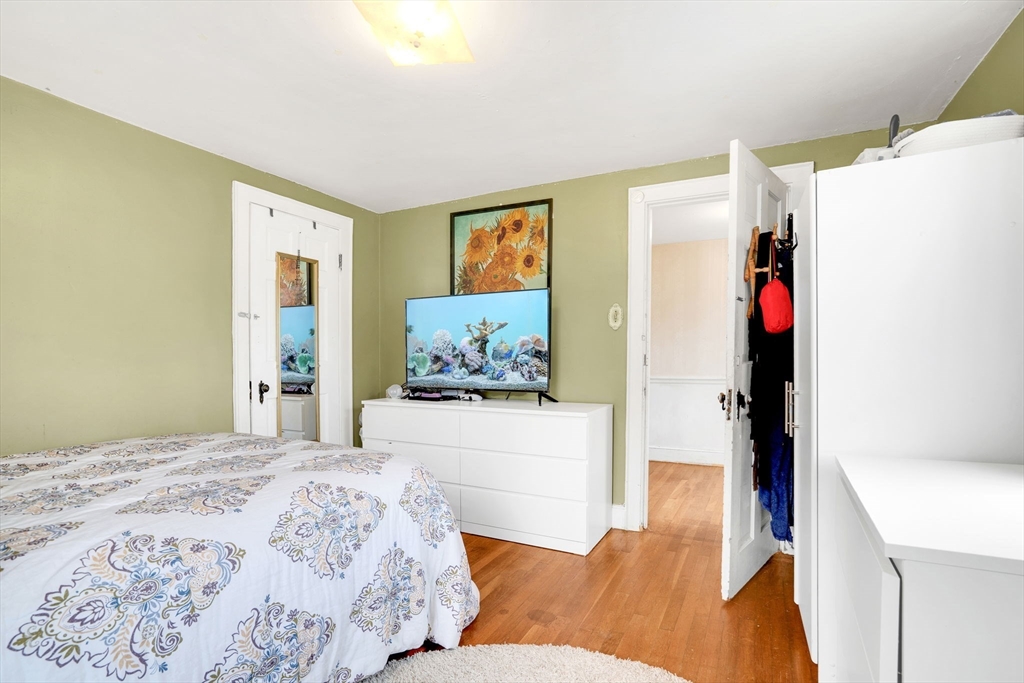 39 Range Road Boston, MA 02124 - Photo 17 of 25 a bedroom with a bed and a couch