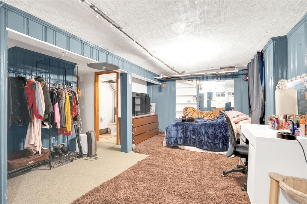 39 Range Road Boston, MA 02124 - Photo 19 of 25 a bedroom with furniture and a window
