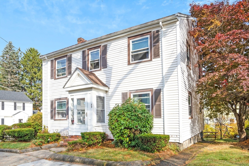 39 Range Road Boston, MA 02124 - Photo 20 of 25 a front view of a house with garden