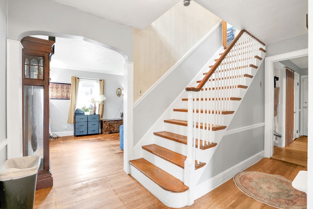 39 Range Road Boston, MA 02124 - Photo 2 of 25 a view of entryway and hall with wooden floor