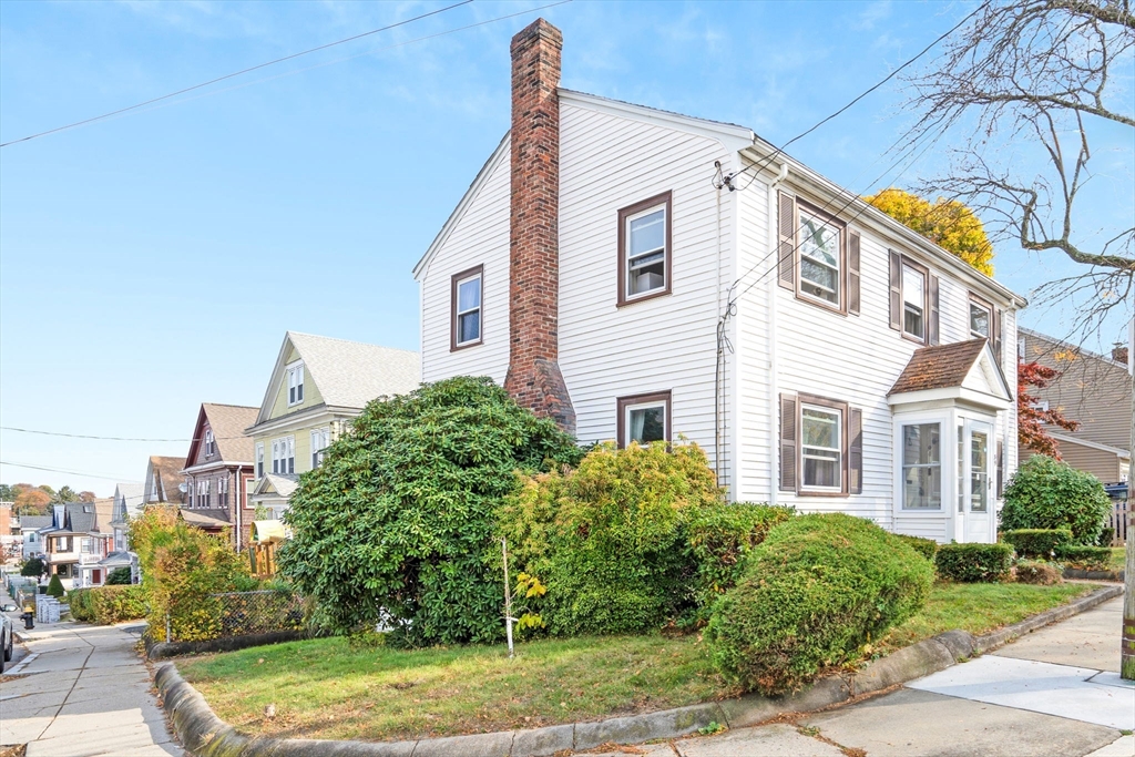 39 Range Road Boston, MA 02124 - Photo 21 of 25 a view of a house with a yard