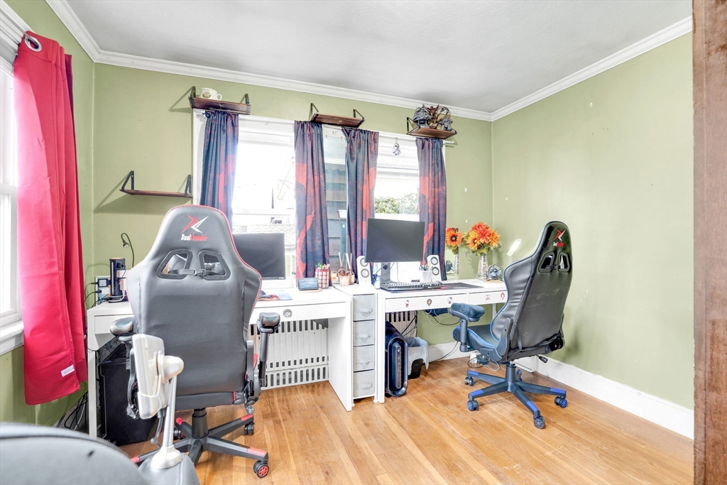 39 Range Road Boston, MA 02124 - Photo 8 of 25 a workspace with furniture and a window