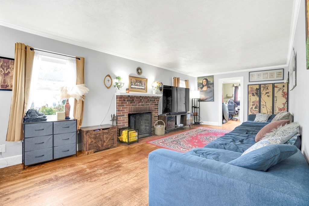 39 Range Road Boston, MA 02124 - Photo 9 of 25 a bed room with furniture and a flat screen tv
