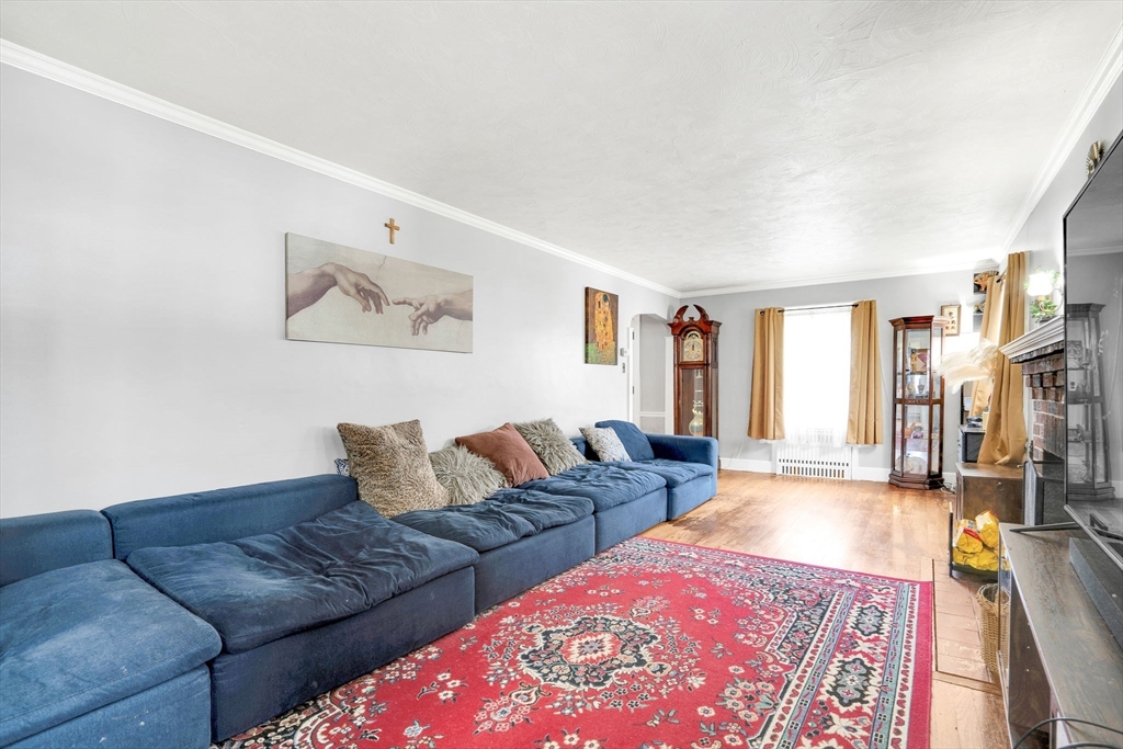 39 Range Road Boston, MA 02124 - Photo 10 of 25 a living room with furniture and a rug