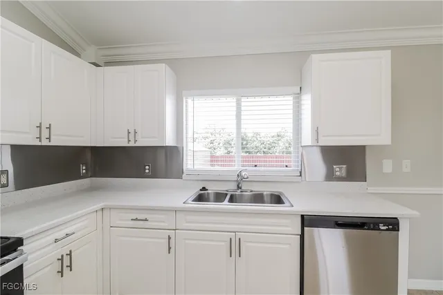 a kitchen with a sink and cabinets