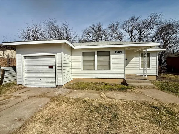 a house with trees in the background