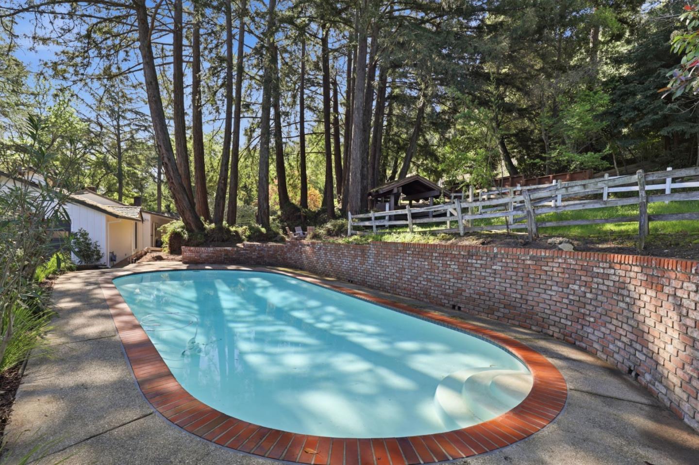425 Summit Spring Road Woodside, CA 94062 - Photo 32 of 42 a view of a backyard with swimming pool