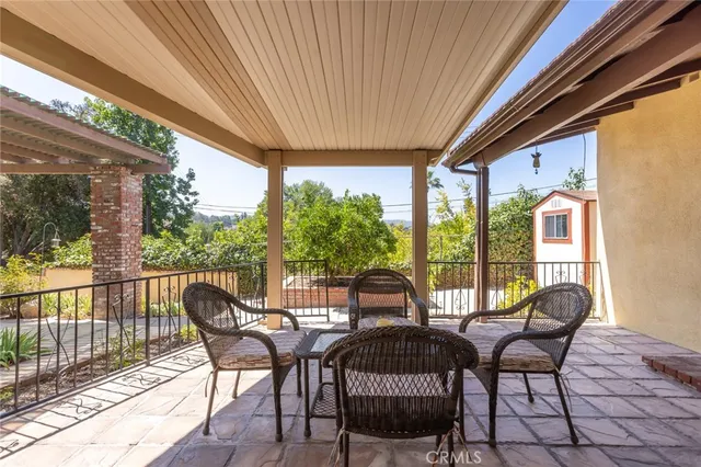 a view of a patio with furniture