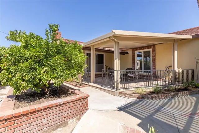 a view of a house with porch and furniture
