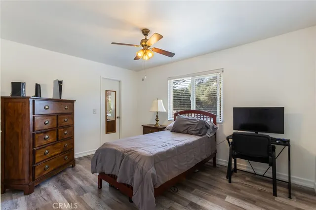 a bedroom with a bed and furniture