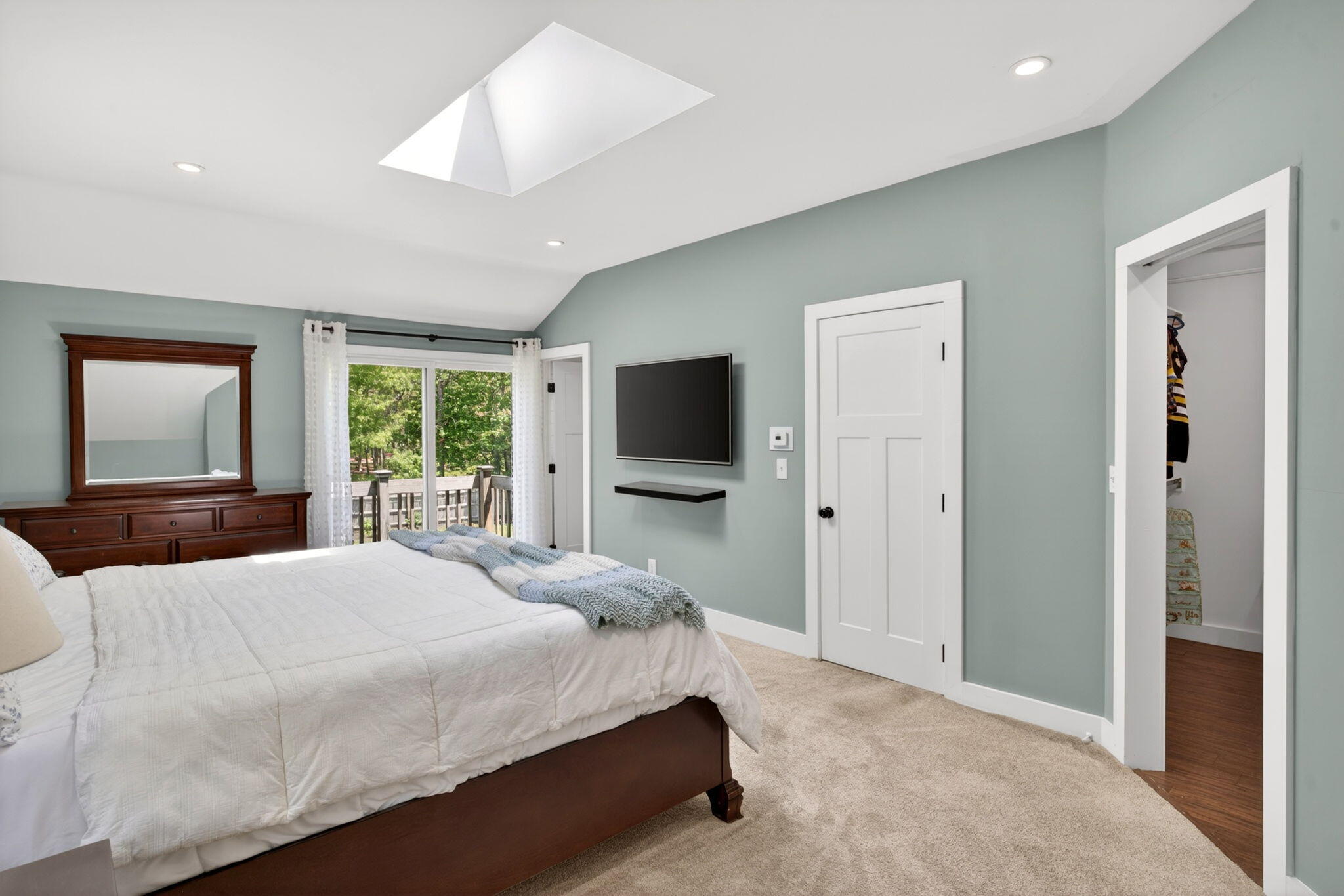 12 Sarah Lawrence Road Sandwich, MA 02563 - Photo 20 of 54 a bedroom with a large bed and a flat screen tv