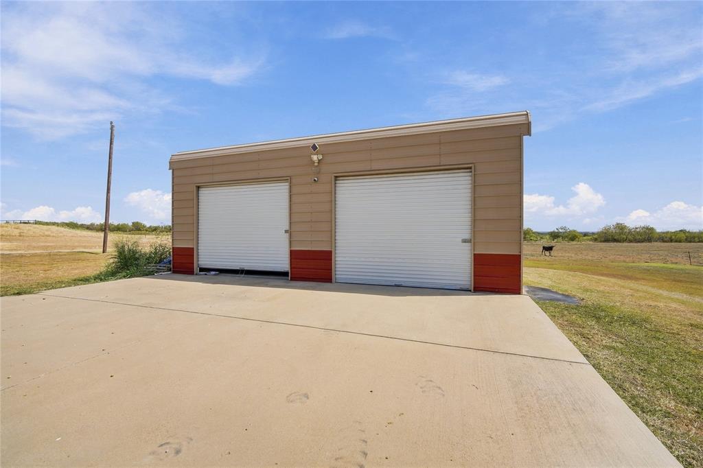 1180 Wiggins Road Maypearl, TX 76064 - Photo 35 of 40 A detached two-bay garage/barn offers extra space for vehicles, equipment, or a workshop.