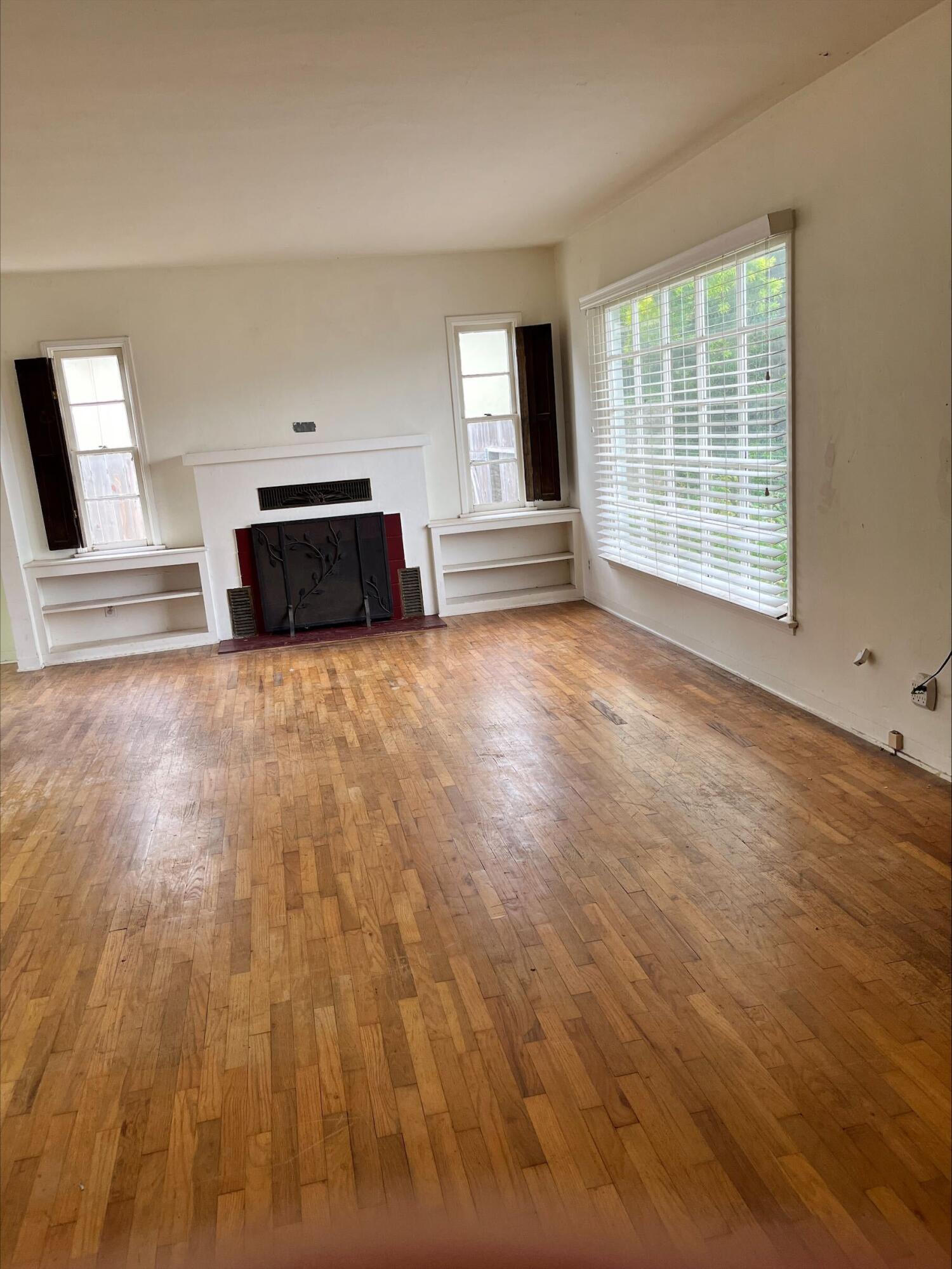 230 South L Street Lompoc, CA 93436 - Photo 6 of 14 a view of empty room with wooden floor and fan