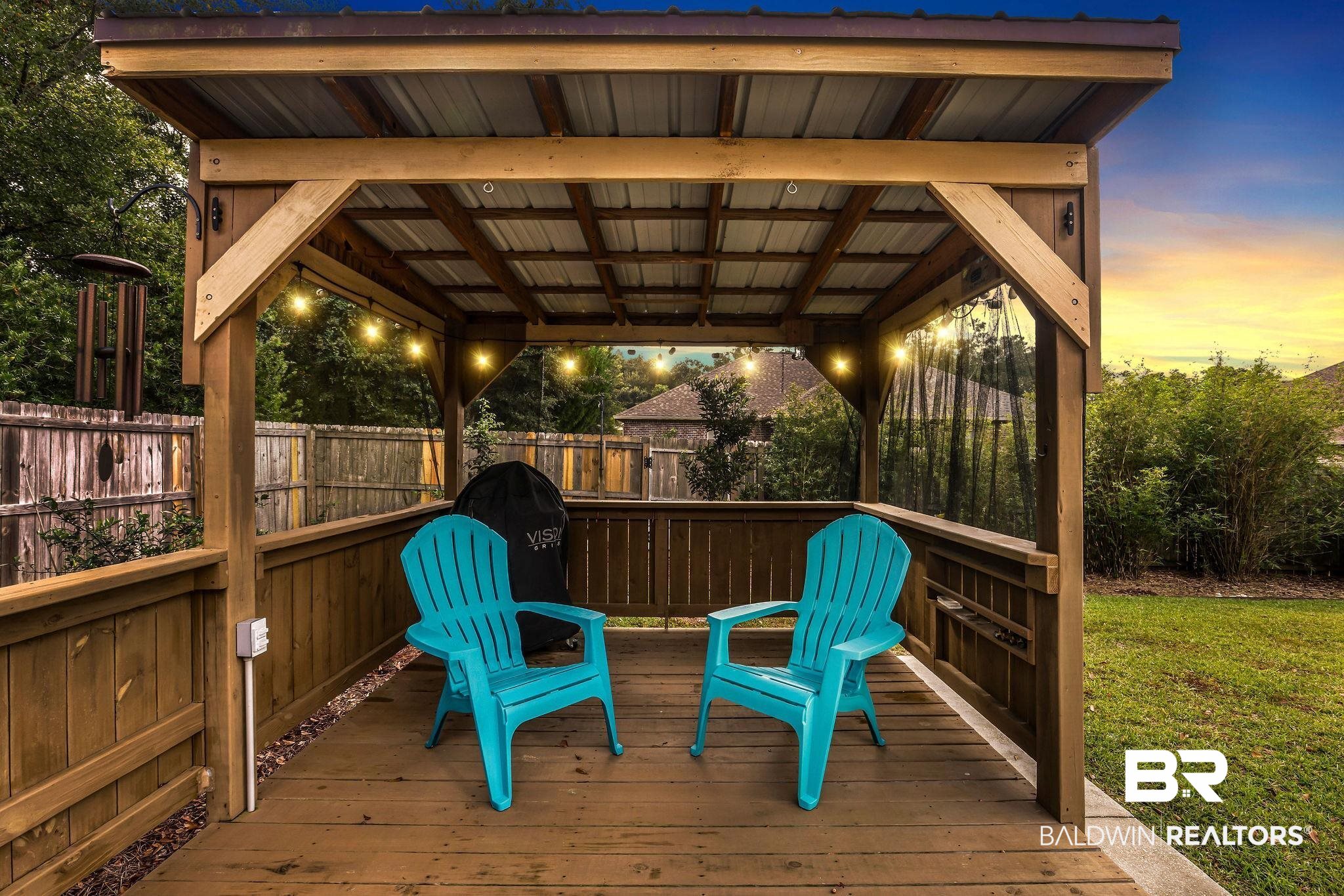 1086 Destin Avenue Foley, AL 36535 - Photo 29 of 30 Deck at dusk with a gazebo and a yard