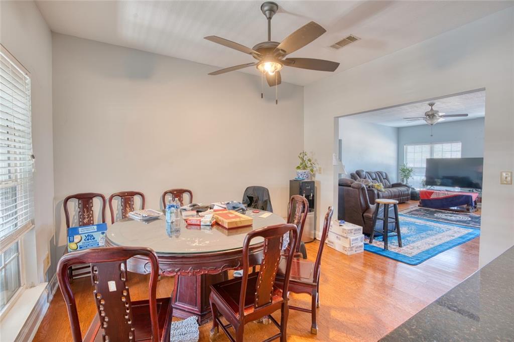 441 Weaver Road Moultrie, GA 31768 - Photo 11 of 48 a view of a dining room with furniture and wooden floor
