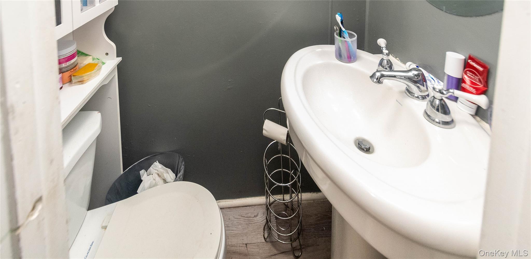 46 Hasbrouck Street Newburgh, NY 12550 - Photo 12 of 26 a bathroom with a sink mirror and toilet