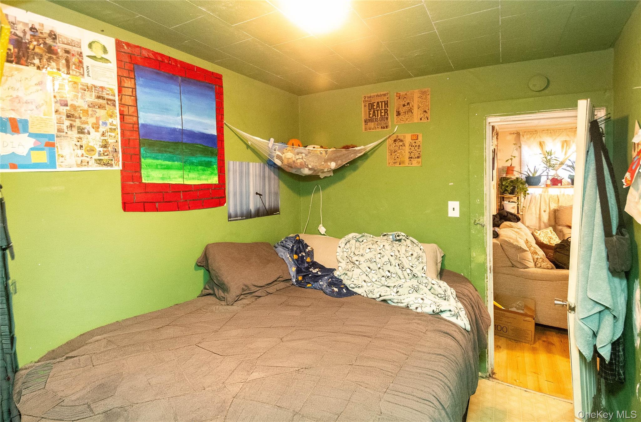 46 Hasbrouck Street Newburgh, NY 12550 - Photo 14 of 26 a bed sitting in a bedroom next to a window