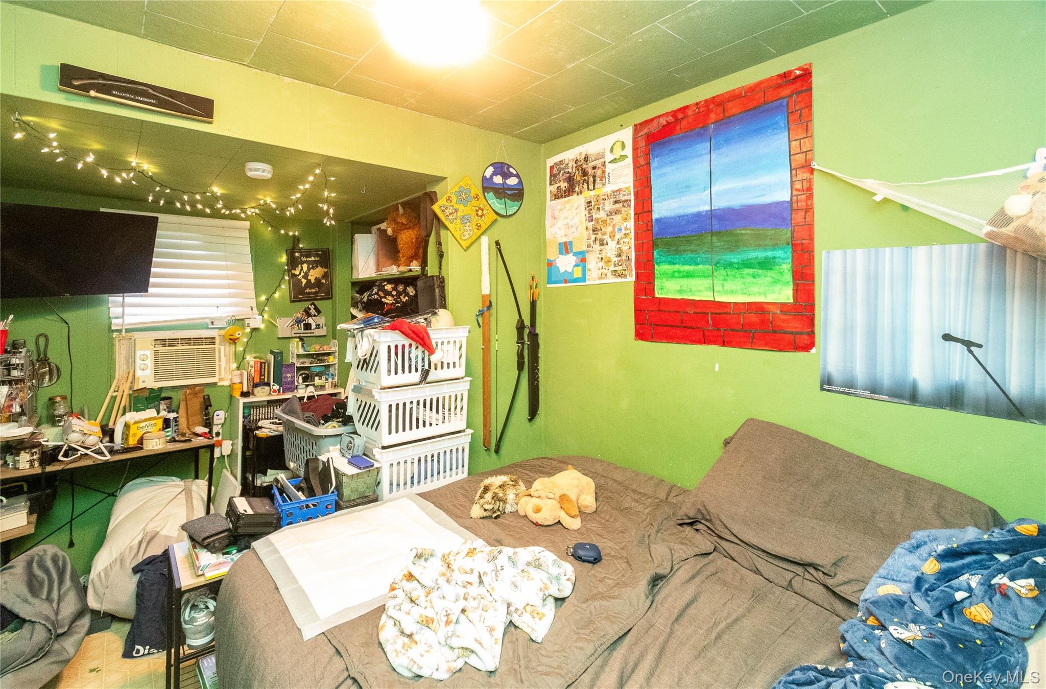 46 Hasbrouck Street Newburgh, NY 12550 - Photo 17 of 26 a bedroom with furniture and a wooden floor