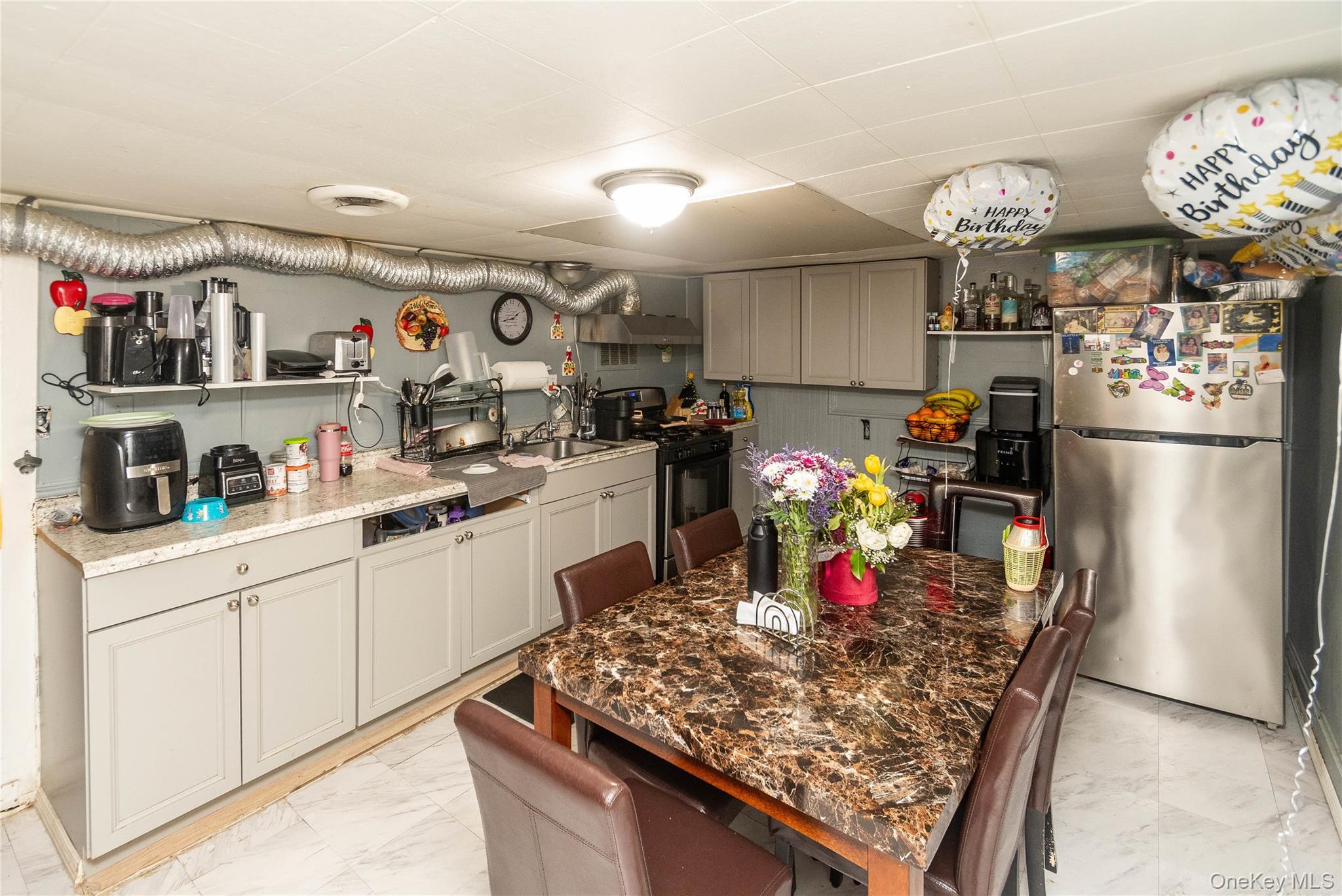 46 Hasbrouck Street Newburgh, NY 12550 - Photo 19 of 26 a kitchen with lots of counter top space and refrigerator