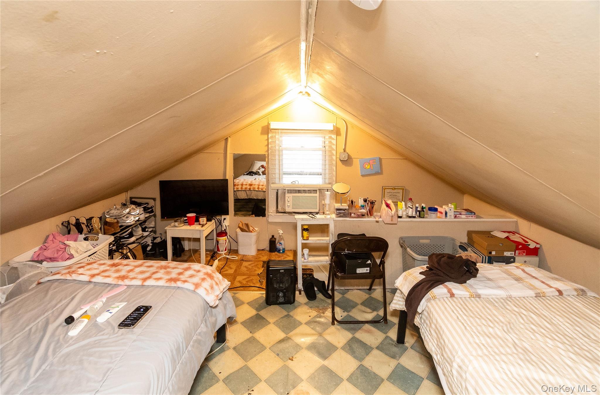 46 Hasbrouck Street Newburgh, NY 12550 - Photo 21 of 26 a bed room with a bed and a chair