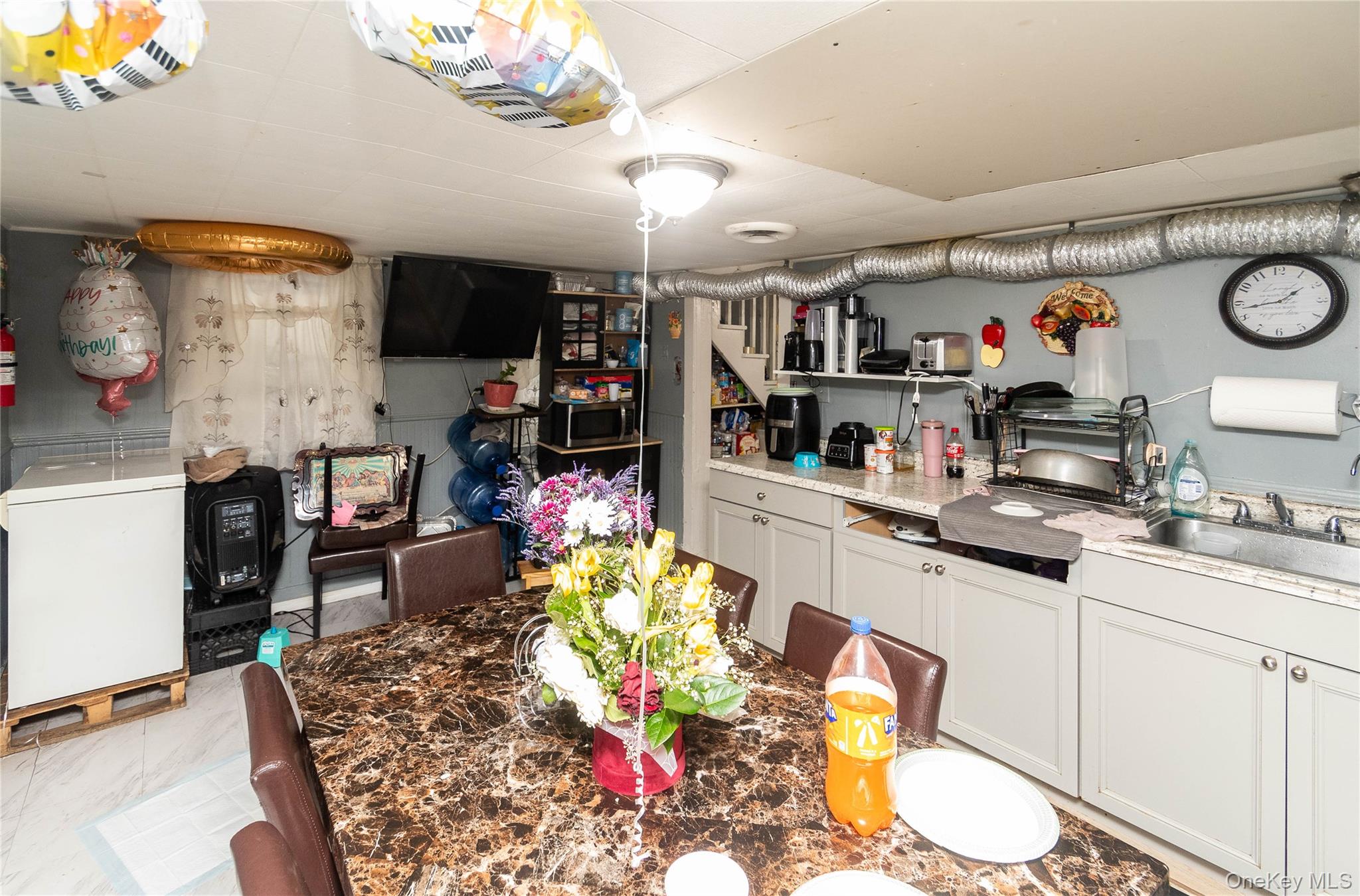 46 Hasbrouck Street Newburgh, NY 12550 - Photo 22 of 26 a kitchen filled with a white stove top oven a sink and dishwasher