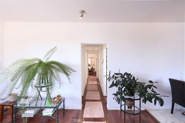 a view of entryway with wooden floor