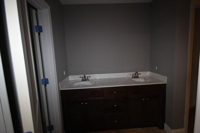 5625 Flewellyn Road Springfield, TN 37172 - Photo 11 of 13 a bathroom with 2 sink and mirror