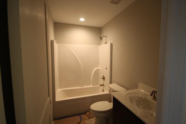 5625 Flewellyn Road Springfield, TN 37172 - Photo 13 of 13 a bathroom with a granite countertop bathtub shower sink mirror and toilet