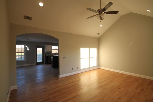 5625 Flewellyn Road Springfield, TN 37172 - Photo 5 of 13 an empty room with wooden floor and windows