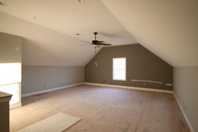 5625 Flewellyn Road Springfield, TN 37172 - Photo 7 of 13 an empty room with a chandelier fan and windows