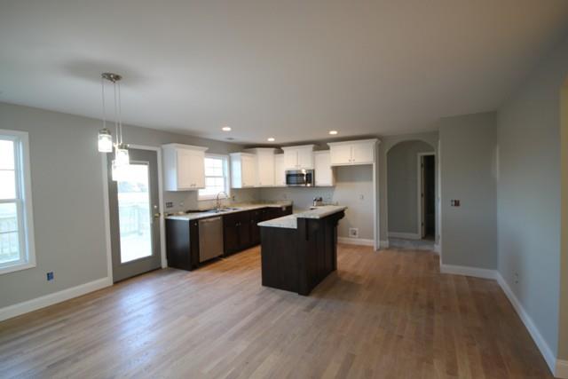5625 Flewellyn Road Springfield, TN 37172 - Photo 8 of 13 a large kitchen with a large counter top a sink stainless steel appliances and cabinets